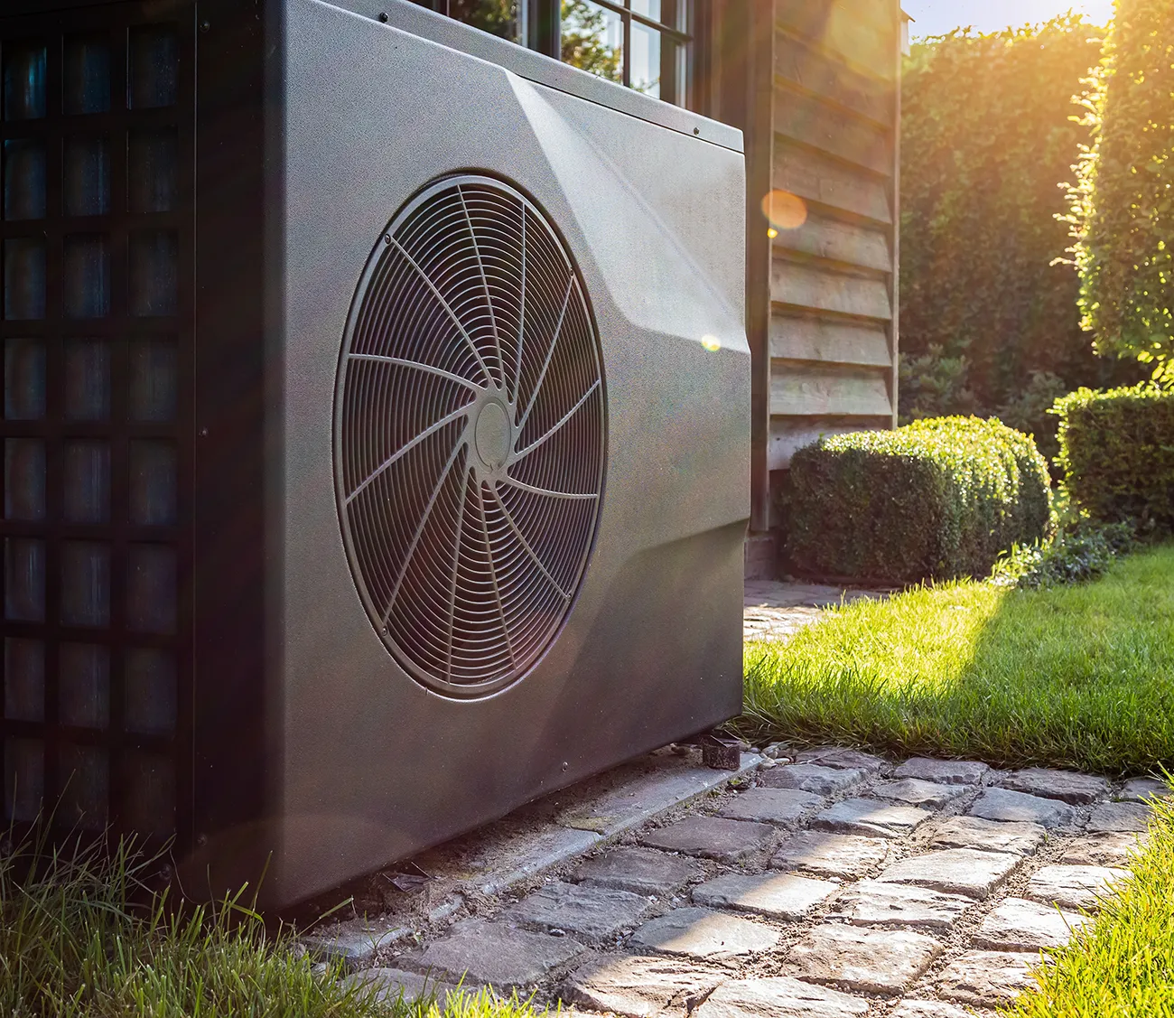 Air heat pump near pool house outdoors
